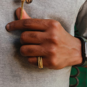 Man in Urban City Wearing Braided Ring