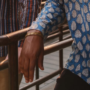 Man in Urban City Wearing Spiritual Cowboy Logo Bracelet